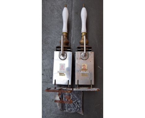 Breweriana: a pair of brass and ceramic ale pumps