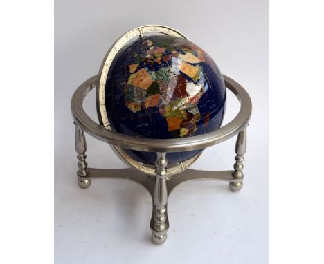 A lapis lazuli and gemstone set pietra dura rotating globe in gimbal-mounted metal frame with four turned supports over compa