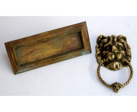 A brass letterbox, 25cmW, and a brass lion mask door knocker with rope twist handle