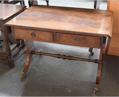 A sofa table with two frieze drawers, raised on swept legs and brass 'paw' casters, 86x56x77cmH, along with a matching smalle