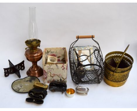 A copper parafin lamp with glass chimney, Ronson cigarette lighter, egg basket, Japanese dish, a pair of brass plant stands, 