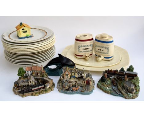 A mixed quantity of ceramics to include Wade, gin and port barrels, a Poole pottery dolphin, works by Wanbury Mint, and vario