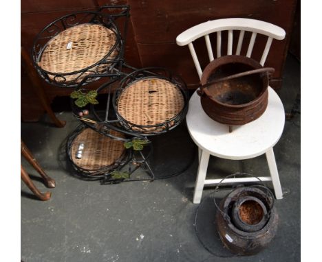 A white painted child's chair with stick back, a cast iron posnet and two other iron pots, and a metal and wicker three tiere