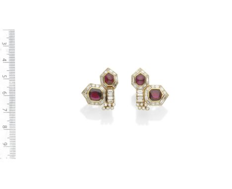 RUBY AND DIAMOND EARCLIPSEach of geometric design, set with oval cabochon and cushion-shaped rubies with borders of calibré-c