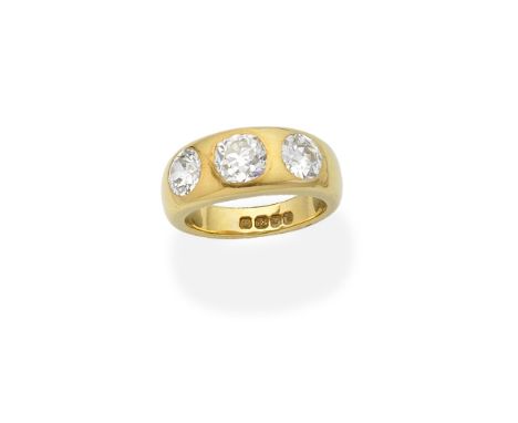 THREE-STONE DIAMOND RING, 1957Set with cushion-shaped and old brilliant-cut diamonds, mounted in 18 carat yellow gold,  princ