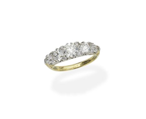 DIAMOND FIVE-STONE RINGSet with graduated old brilliant-cut diamonds, accented by single-cut diamonds, the gallery of scrollw