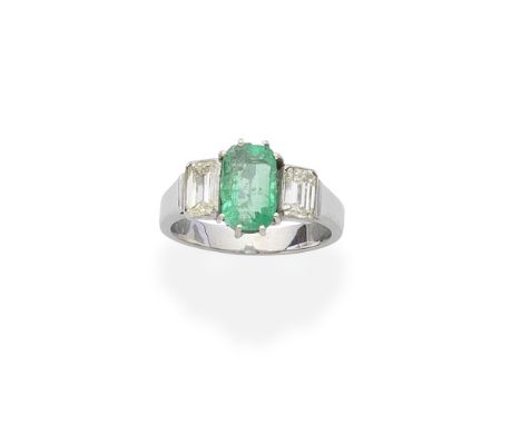 EMERALD AND DIAMOND RINGThe central step-cut emerald within a four claw setting, between step-cut diamond shoulders, diamonds