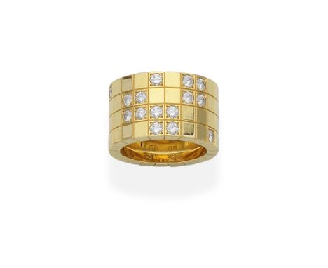 CARTIER: DIAMOND-SET 'LANIÈRES' RINGThe 18 carat yellow gold band engraved as a grid, accented by brilliant-cut diamonds, sig