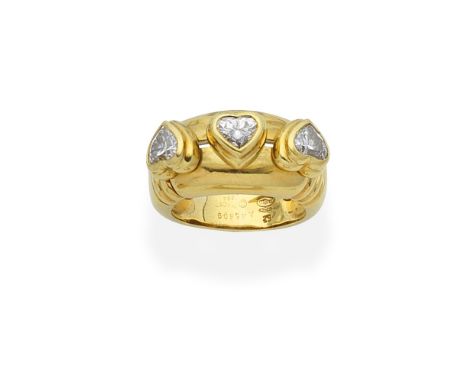PIAGET: DIAMOND RINGSet with a sliding trio of heart-shaped diamonds, signed Piaget, numbered, maker's marks,  ring size appr