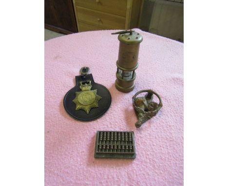 Brass items including miniature Davey lamp, door knocker, Norfolk constabulary horse brass and Abacus with marble base 