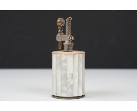 An early 20th century French table lighter with mother of pearl decoration.