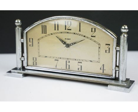 Art Deco chrome 8 day mantle clock, the domed face with Arabic numerals, raised on stepped feet, 16cm long