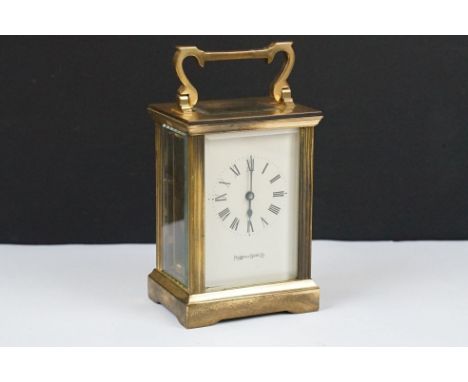 A Mappin &amp; Webb brass cased carriage clock, beveled glass panels with white enamel dial, complete with key.