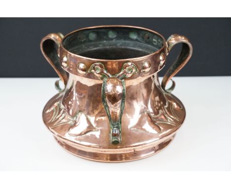 Early 20th century arts and crafts copper planter jardiniere with three scrolled handles ended in leaf terminals, heart/spade