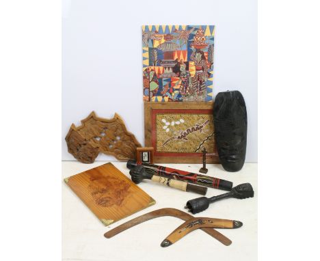 A large selection of African and Aboriginal art and collectables to include mask, boomerang and carving