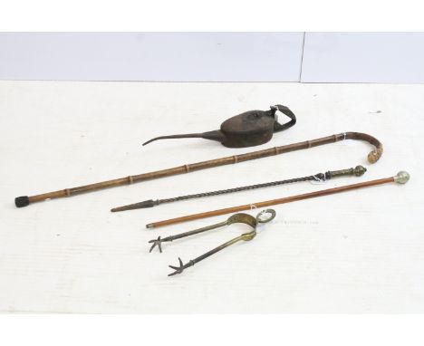 Early 20th century swagger stick with crested finial, 66cm long, a Victorian fire poker, 64.5cm, an early 20th century bamboo