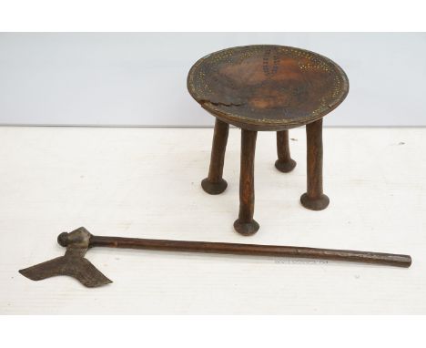 African stool, top set with brass and beads detailing, on four carved legs, H 33cm, diameter 35.5cm with antique axe