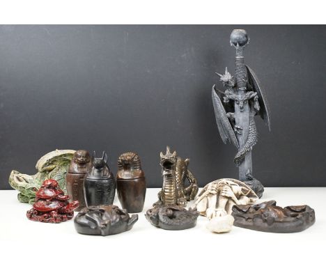 Dragon and sword candlestick with skull motif, folk art style Lincoln Cathedral wooden bat, lion and sea monster hanging carv