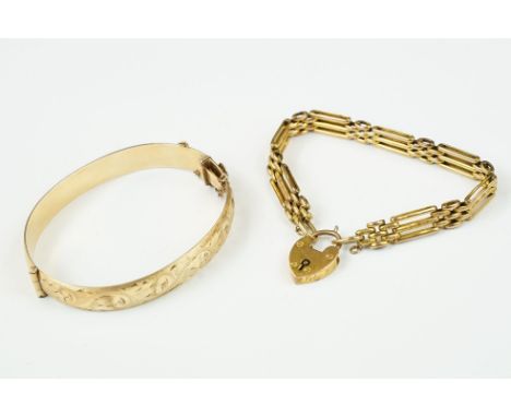 A fully hallmarked 9ct gold gate bracelet with heart clasp together with a 9ct rolled gold bangle. 