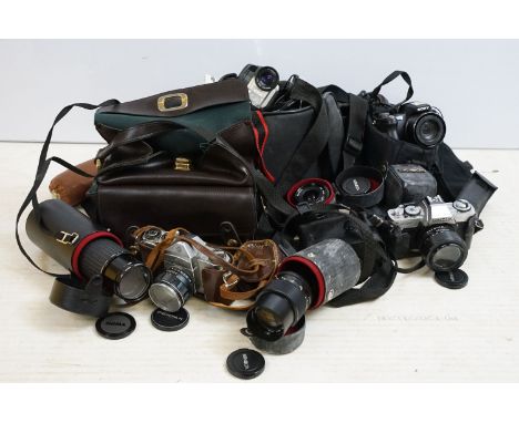 Large quantity of cameras to include Sony super steady shot, Sigma lens f-70-210mm, Minolta lens 1:35 and 35mm 1:28, Asahi Pe