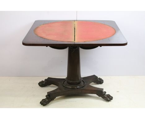 William IV 19th century rosewood card / games table with scrolled carved detailing to side, raised atop four lions paw feet o