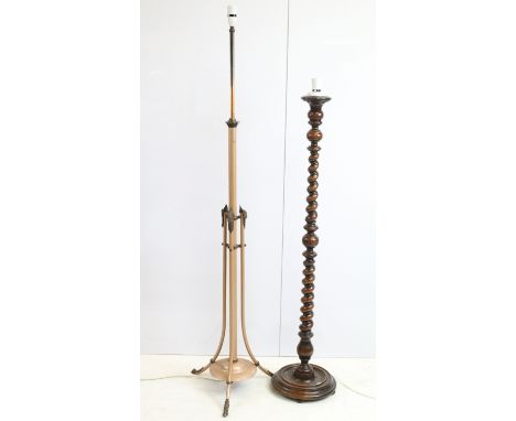 Large wooden barley twist standard floor lamp, H 125cm together with a brass tripod floor lamp with ram's head detail decorat