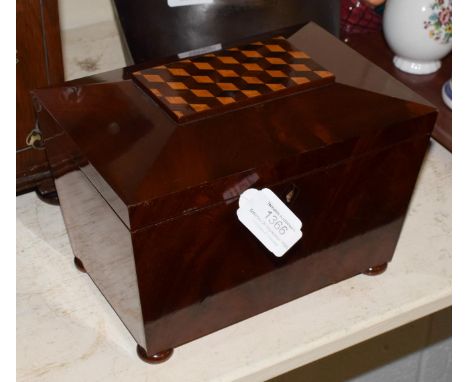 A late 19th century mahogany sarcophagus shaped tea caddy with parquetry decoration to cover 
