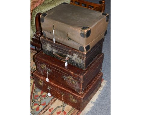 Three brown crocodile leather travel cases, one with dust cover, case stamped A. Barrett &amp; Sons. 63 &amp; 64 Piccadilly w