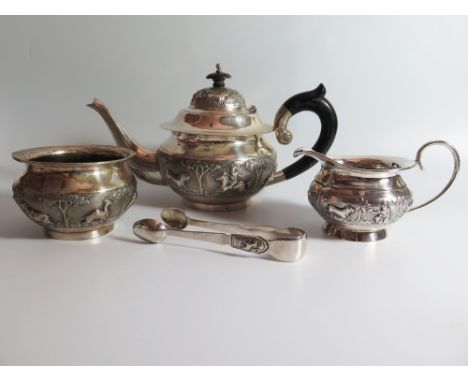 An Indian Silver Silver Three Part Tea Set and sugar tongs, stamped 90, sucrier handles loose, 857 g