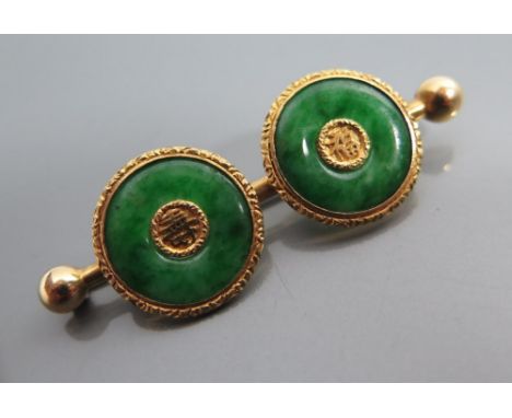 A Chinese Jadeite Jade 'Happiness and Long Life Brooch in gold setting, stone tested as natural colour, stamped LW 90, 53 mm 