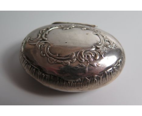 A Nineteenth Century Continental White Metal Snuff Box with foliate scroll decoration, probably Swiss