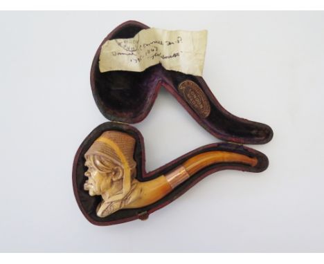 A Meerschaum Pipe carved as a portrait lampooning 'The Liberator' Daniel O'Connell M.P. 1775-1847, with a gold band and in We