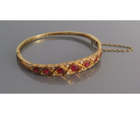 A Victorian 9ct Gold Ruby and Pearl Hinged Bangle, Birmingham 1896