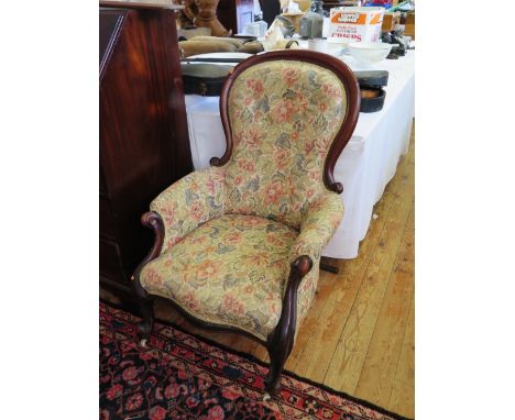 A Victorian Mahogany Framed Balloon Button Back Armchair
