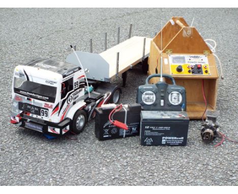 Thunder Tiger - Nitro powered remote control truck with trailer, power panel and spare engine and accessories. In good but du