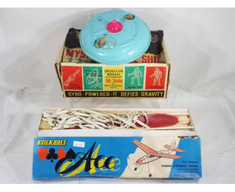 Vintage toys - a Gyro powered spaceship by Marx and a wooden plane in kit form by Ace, both are in original boxes and are in 