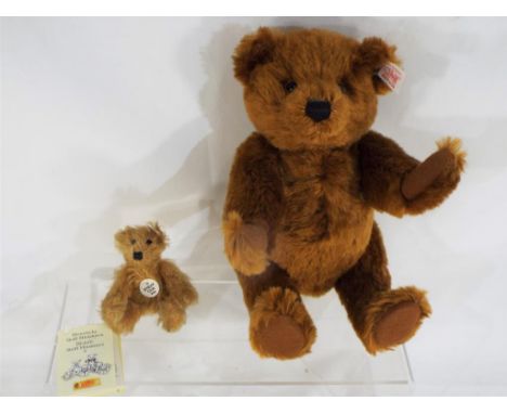 Two Steiff bears, one white tag label with button in ear, stitched nose, approximately 26 cm (h) and a miniature mohair Steif