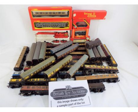 Model Railways - a quantity of predominantly unboxed Hornby OO gauge items comprising 34 coaches, four wagons and a crane, al