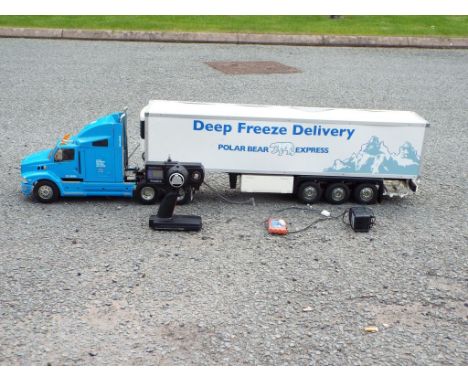 Tamiya - 1:14 scale battery powered remote control Ford Aeromax truck with deep freeze delivery trailer, model is in good to 