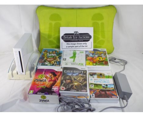 Nintendo Wii - a collection of Nintendo Wii items to include a console with power adapter, balance board and twenty six games