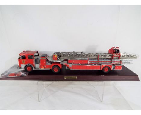 Franklin Mint 1:32 scale 1965 Seagrave Aerial Ladder Truck on plinth, some loose parts but overall in excellent condition (un