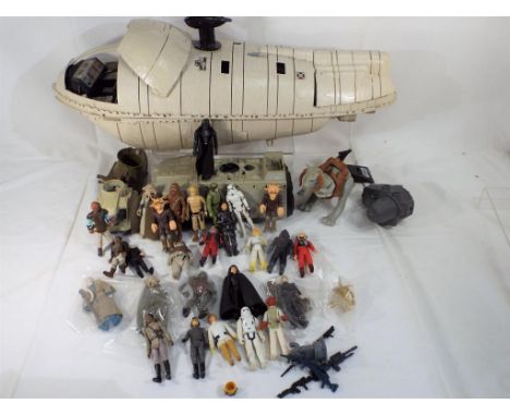 Kenner - a Star Wars transport ship and nine Star Wars figures, all unboxed, very good to excellent condition Est £20 - £40  