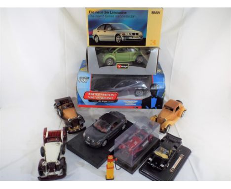 Burago and others - five large scale diecast model motor vehicles and three wooden vehicles including a James Bond radio cont