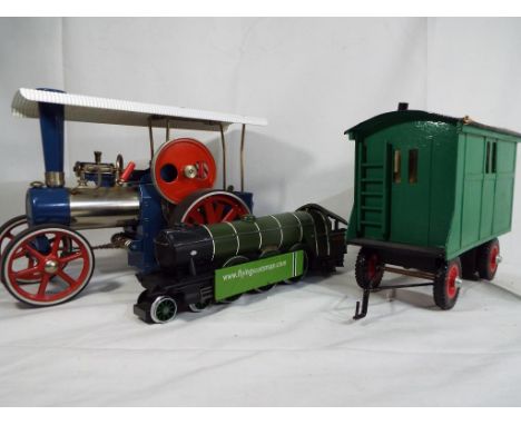 Wilesco - Steam powered traction engine with scratch built caravan and static model of the Flying Scotsman (O gauge). Items v
