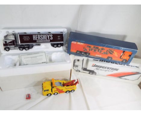 Diecast - a diecast DAF Lorry 1.50 scale model by Lion-Toys #2059, Brechtel Master Lift Comfort Pickup Truck, MAN TGA with mi