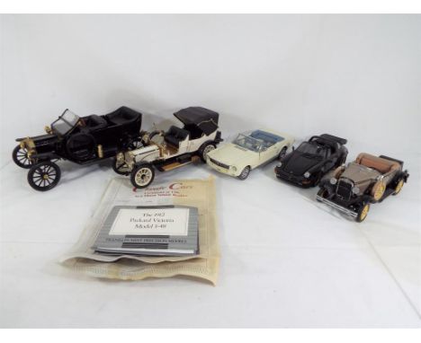 Franklin Mint - five unboxed vehicles comprising a 1966 Ford Mustang, a 1988 Porsche 911, a 1931 Ford Model A, a 1912 Packard