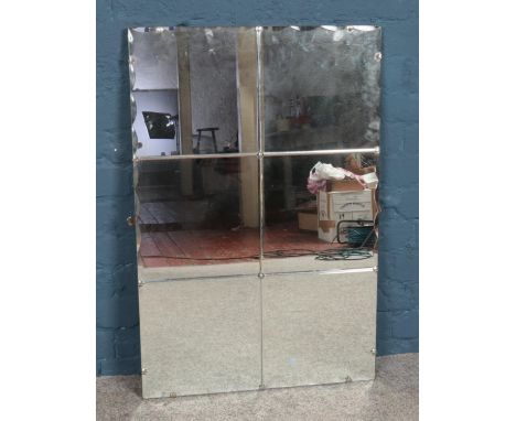 A vintage bevelled mirror. 92cm x 61cm.  