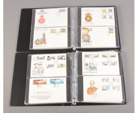 Two albums containing a collection of first day covers, including Isle of Man examples (approximately 118).  
