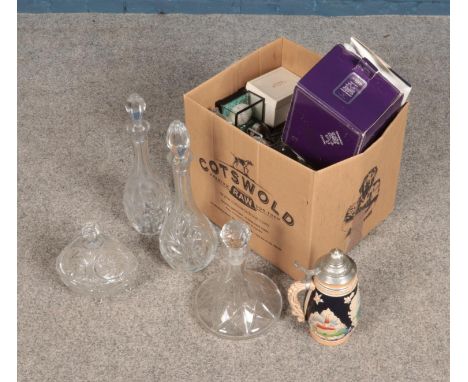 A box of miscellaneous including several glass decanters and a mens Rotary watch.  