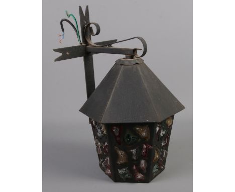 A Peter Marsh style coloured glass and wrought iron porch lantern.  